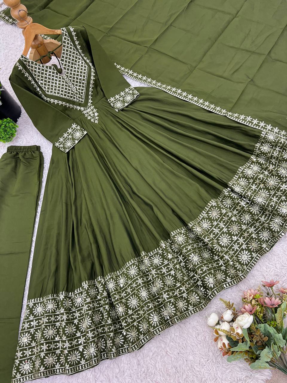 Green mirror-work kurti with silver embroidery, flared sharara pants, and coordinated embroidered dupatta.