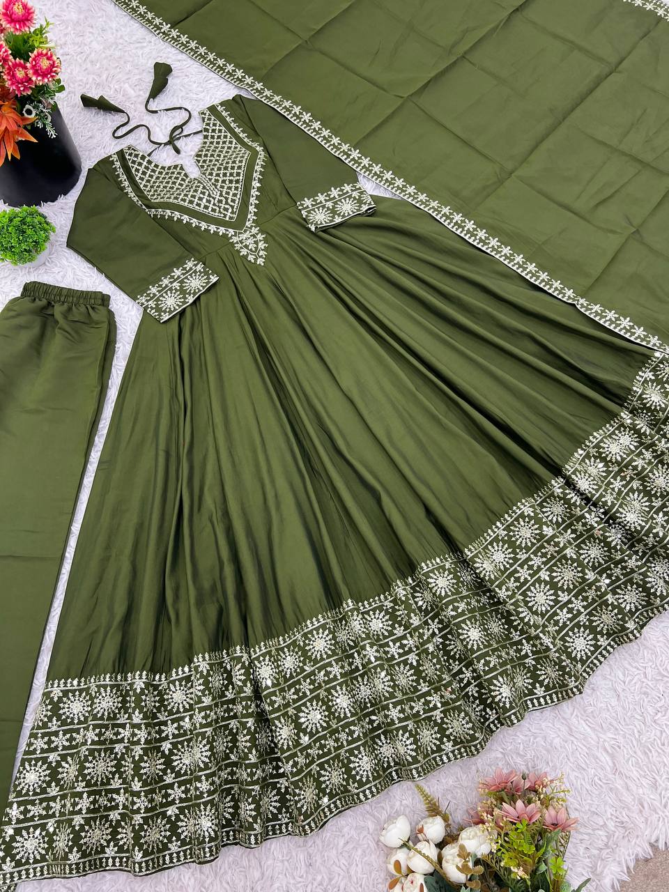 Green mirror-work kurti with silver embroidery, flared sharara pants, and coordinated embroidered dupatta.