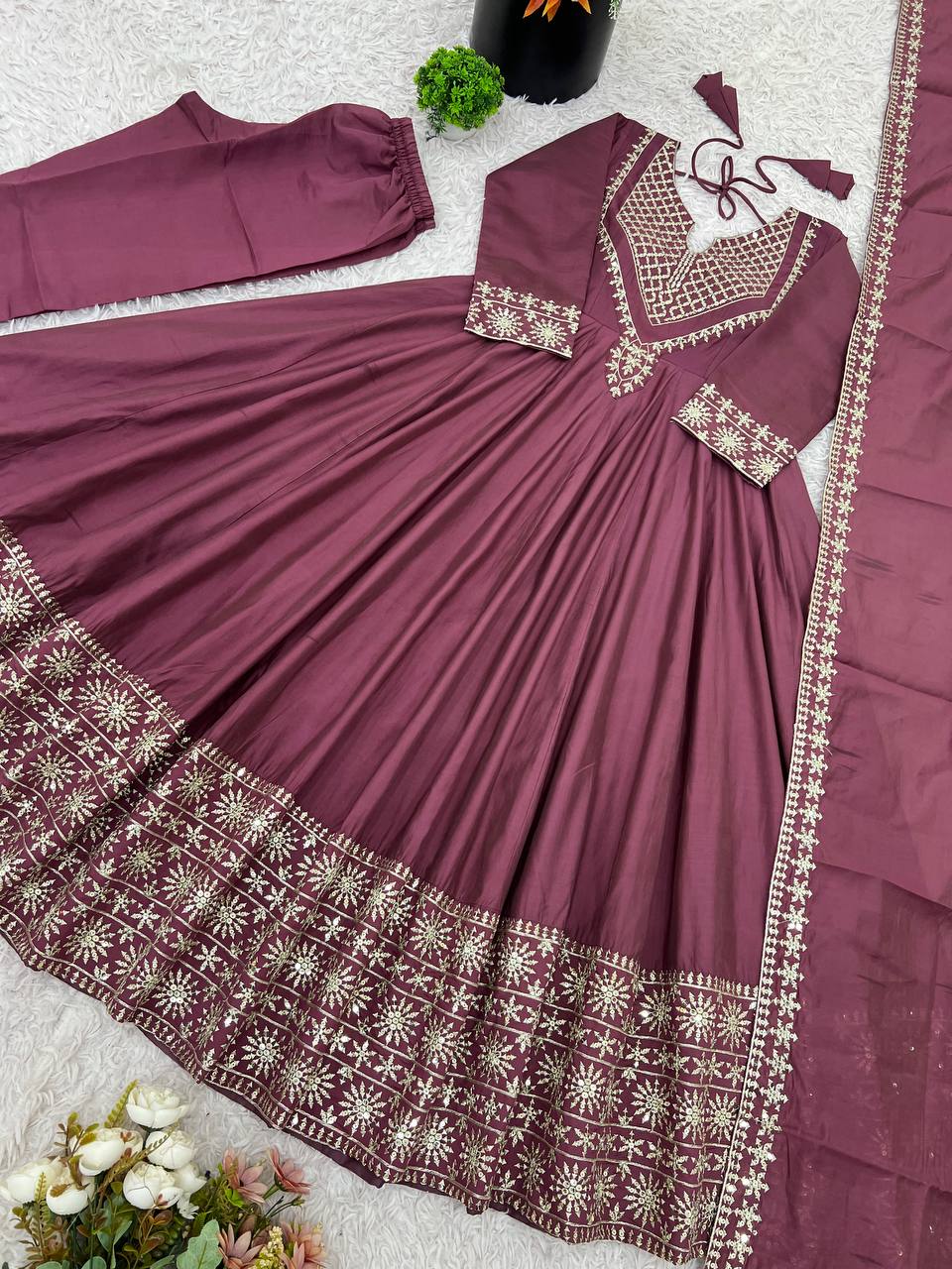 Magenta mirror-work kurti with silver embroidery, flared sharara pants, and coordinated embroidered dupatta.