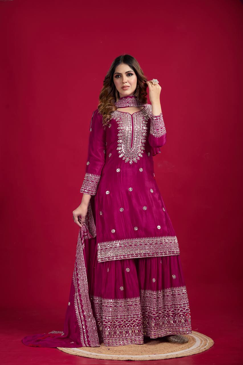 Magenta mirror-work kurti with silver embroidery, flared sharara pants, and coordinated embroidered dupatta.