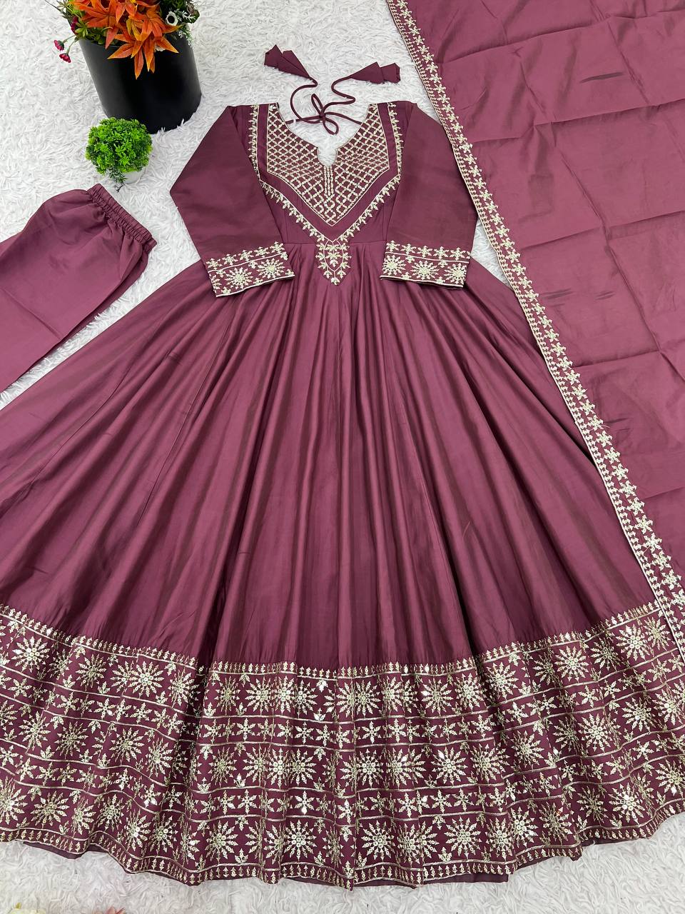 Magenta mirror-work kurti with silver embroidery, flared sharara pants, and coordinated embroidered dupatta.