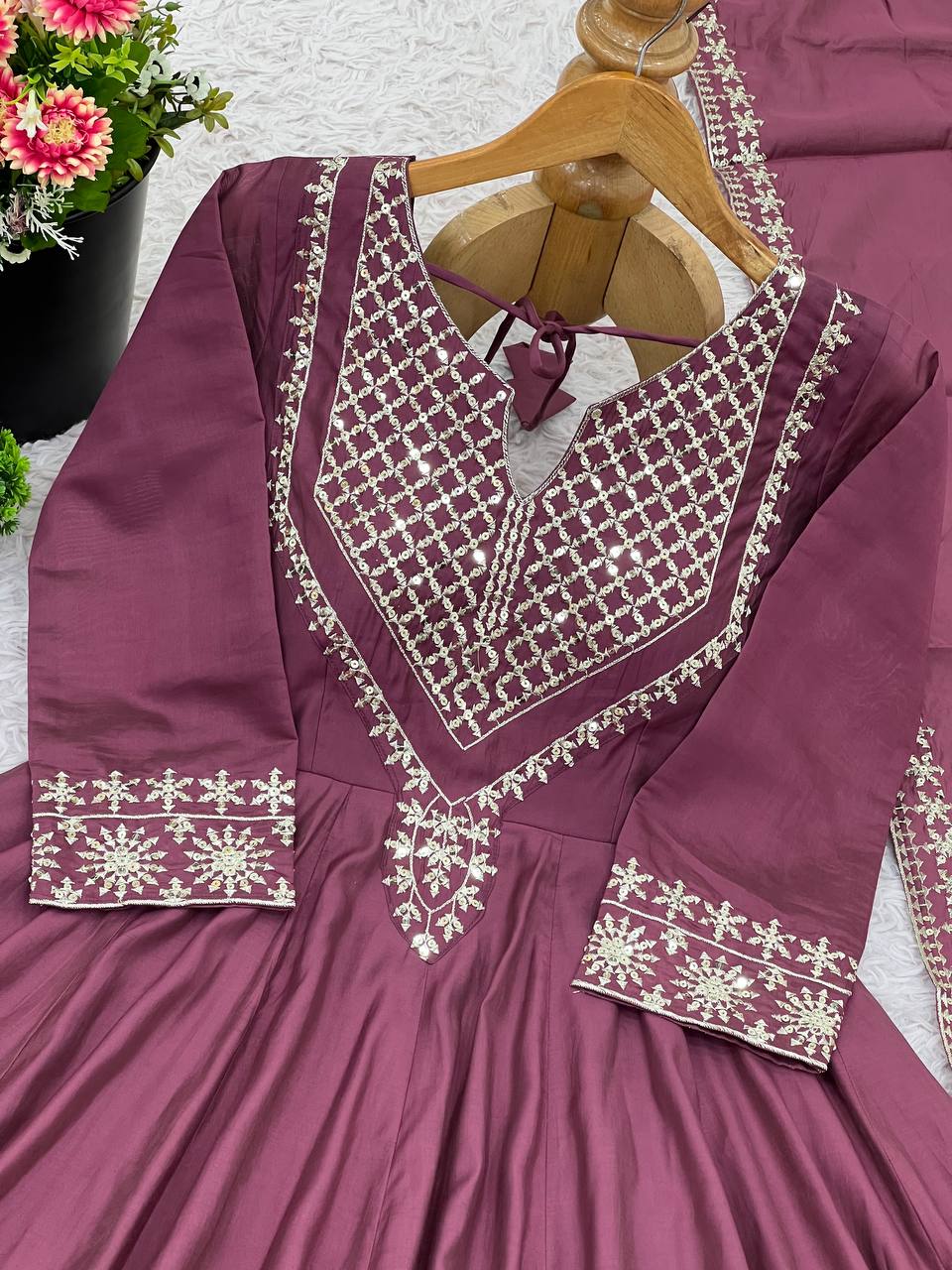 Magenta mirror-work kurti with silver embroidery, flared sharara pants, and coordinated embroidered dupatta.