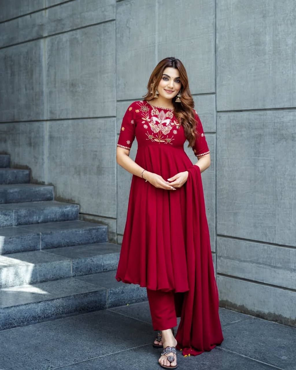 Maroon georgette embroidered high-low kurti paired with straight pants and a matching draped dupatta