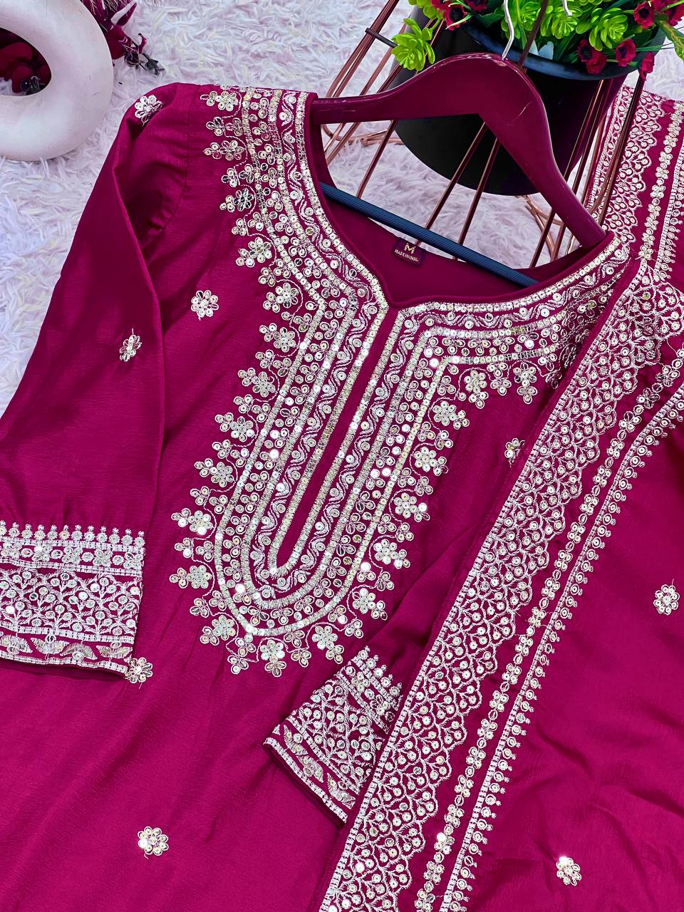 Magenta mirror-work kurti with silver embroidery, flared sharara pants, and coordinated embroidered dupatta.