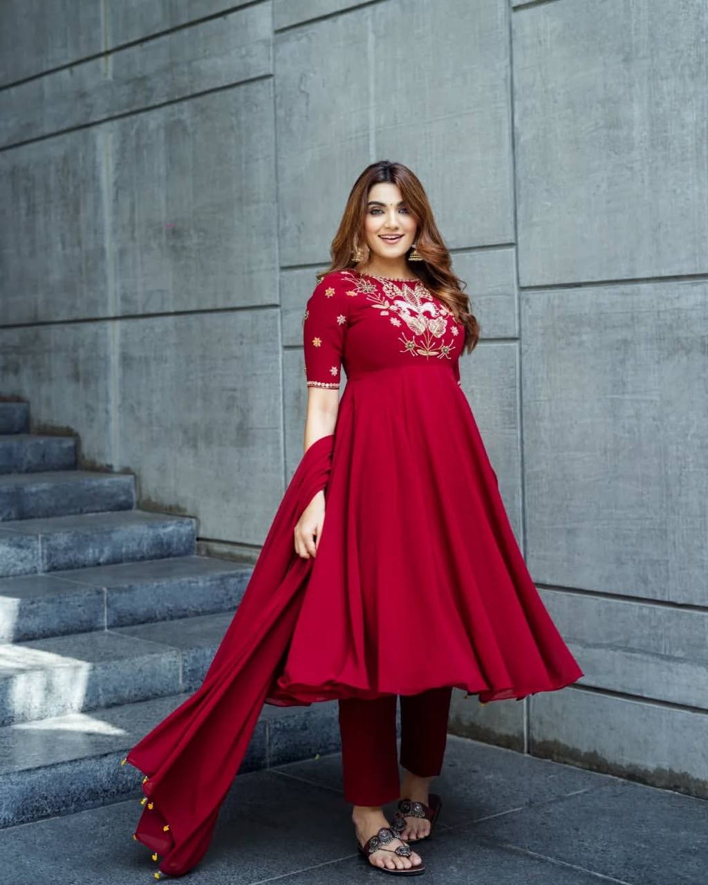 Maroon georgette embroidered high-low kurti paired with straight pants and a matching draped dupatta