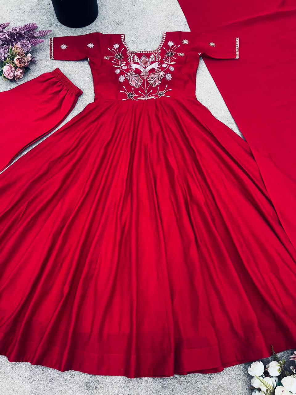 Maroon georgette embroidered high-low kurti paired with straight pants and a matching draped dupatta