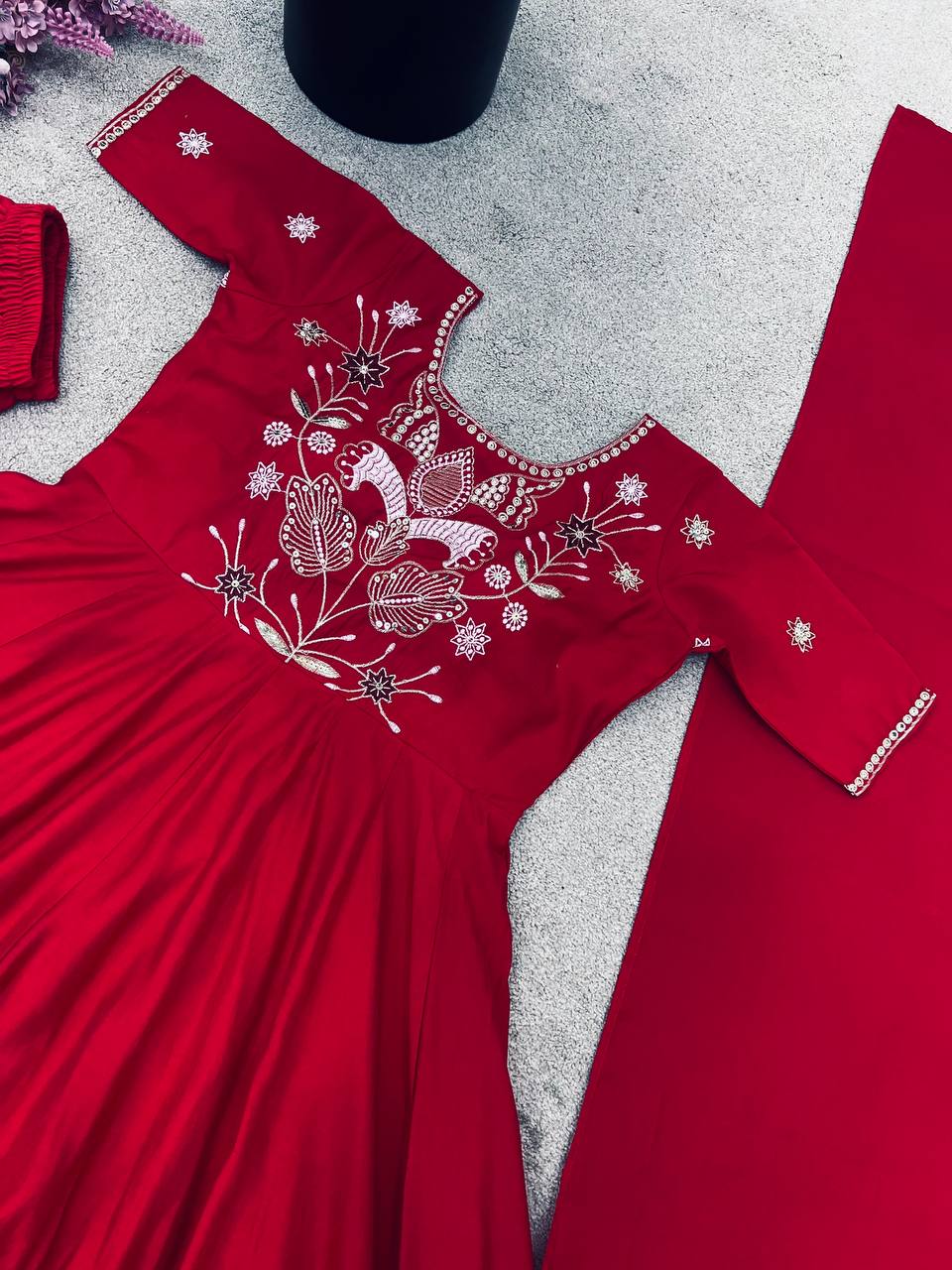 Maroon georgette embroidered high-low kurti paired with straight pants and a matching draped dupatta