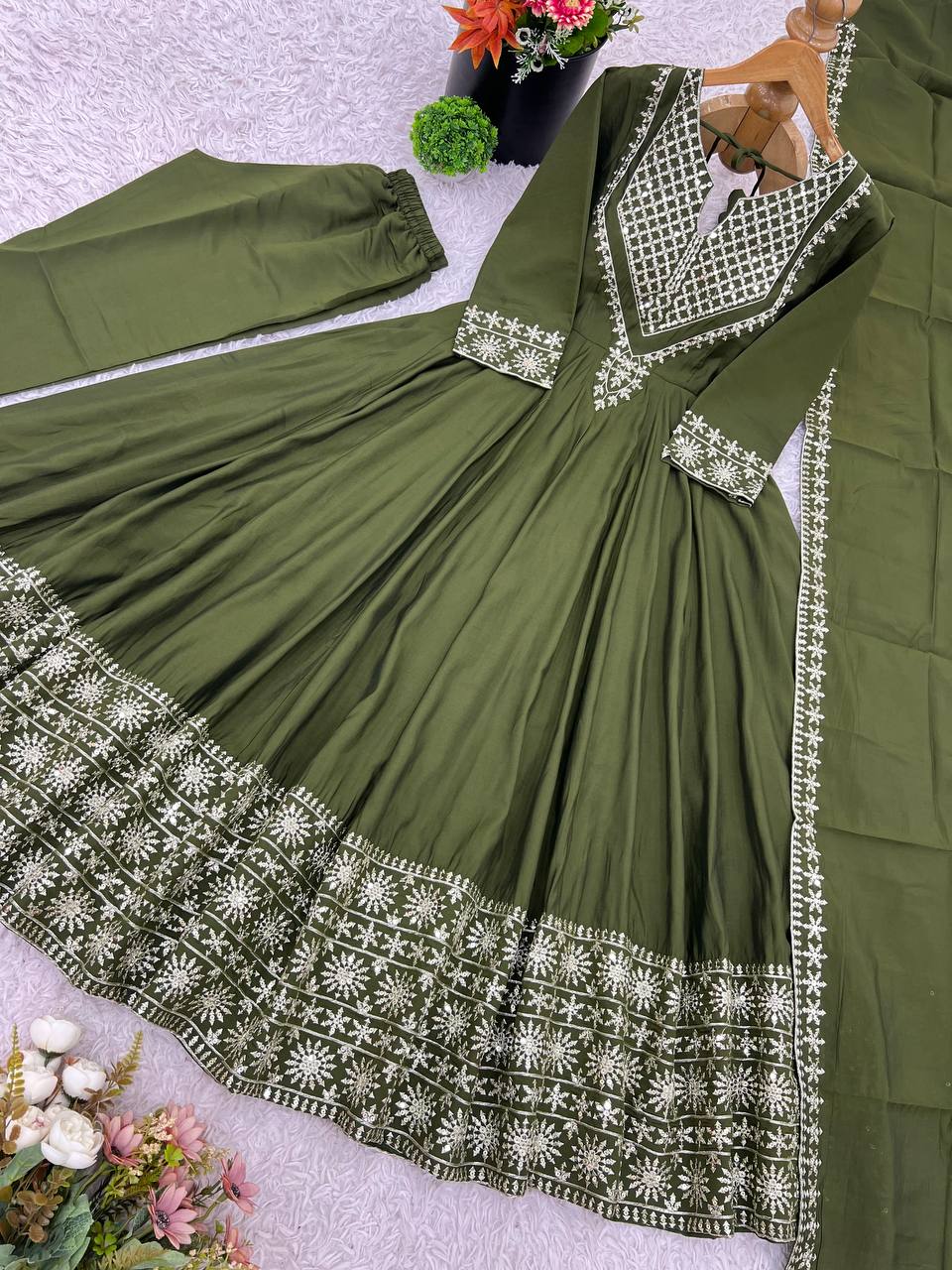 Green mirror-work kurti with silver embroidery, flared sharara pants, and coordinated embroidered dupatta.